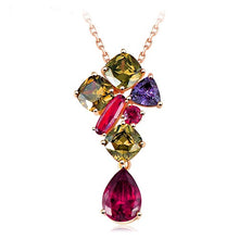 This necklace pendant has 7 total swarovski crystals, 3 of them amber, one purple, two bright reds, and a low hanging ruby red at the bottom. The upper crystals are in a vertical structure similar to a top heavy triangle, coming to a point where the ruby hangs from.